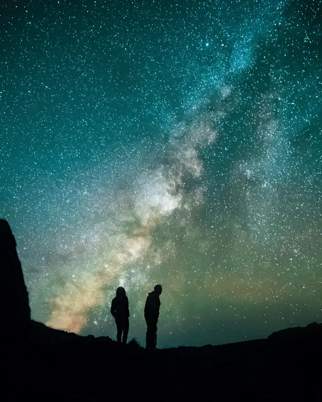 Two ranch guests looking at the Milky Way night sky